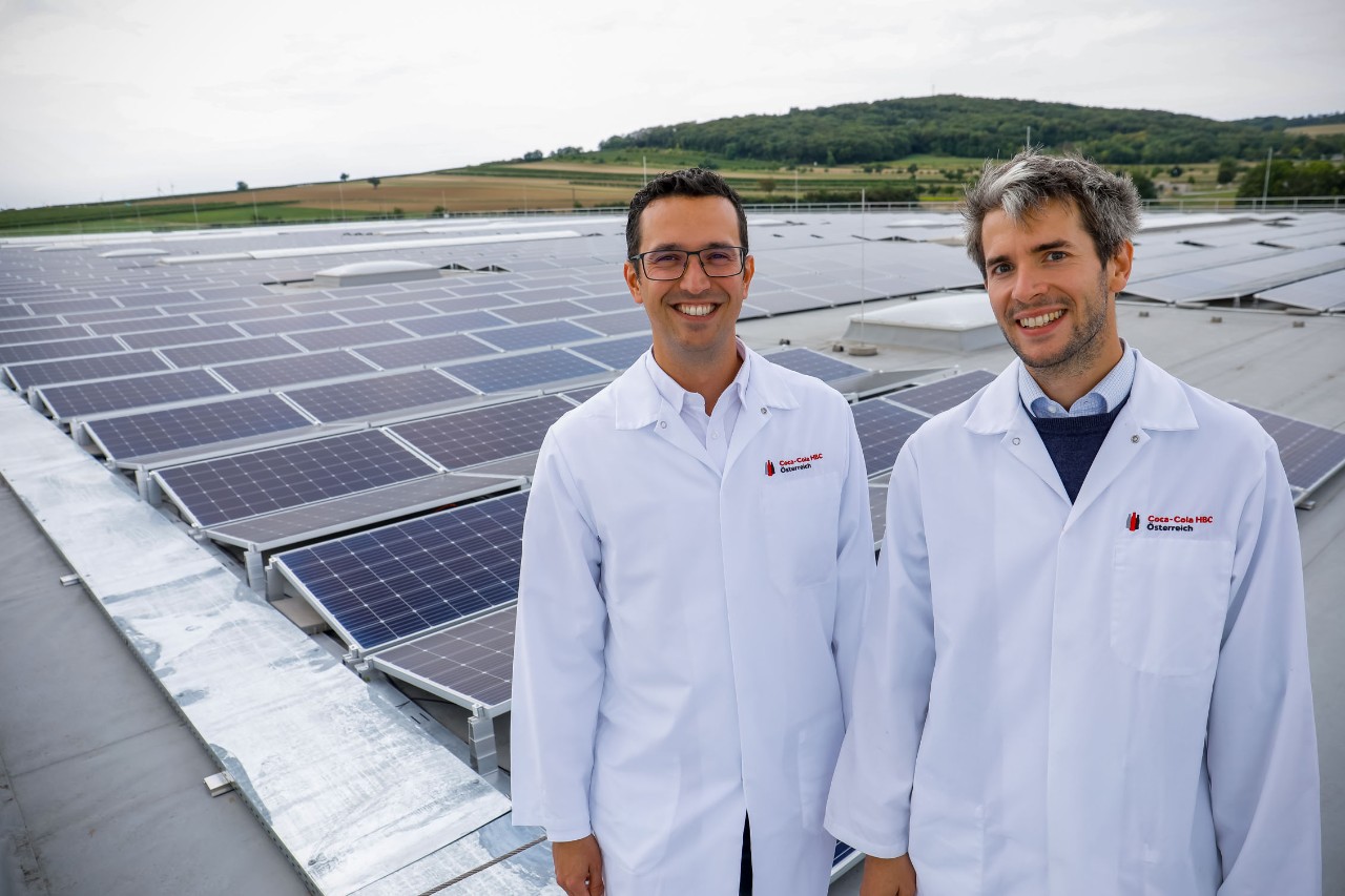 Plant team in front of photovoltaic system